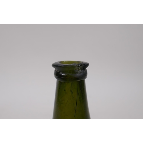 27 - An C18th onion shaped olive green glass wine bottle, 19cm high