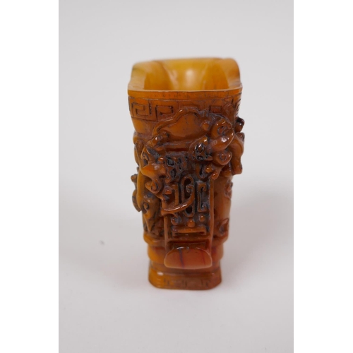 33 - A Chinese carved bone libation cup with kylin decoration, 7cm high