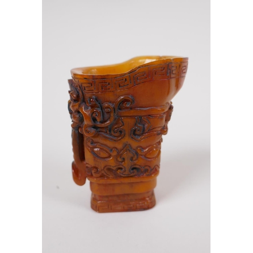 33 - A Chinese carved bone libation cup with kylin decoration, 7cm high