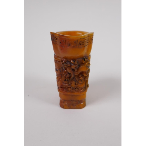 33 - A Chinese carved bone libation cup with kylin decoration, 7cm high