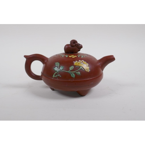 35 - A Chinese YiXing teapot with polychrome enamel floral decoration, marks to base, 12cm diameter