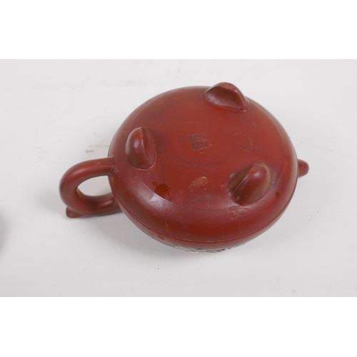 35 - A Chinese YiXing teapot with polychrome enamel floral decoration, marks to base, 12cm diameter