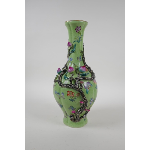 37 - A polychrome porcelain vase with raised peach tree decoration on a green ground, Chinese Qianlong se... 