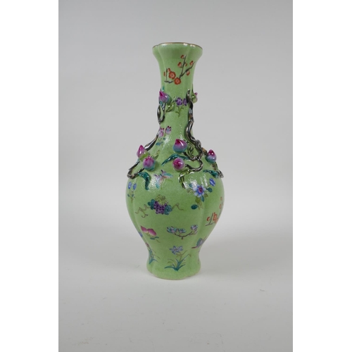 37 - A polychrome porcelain vase with raised peach tree decoration on a green ground, Chinese Qianlong se... 