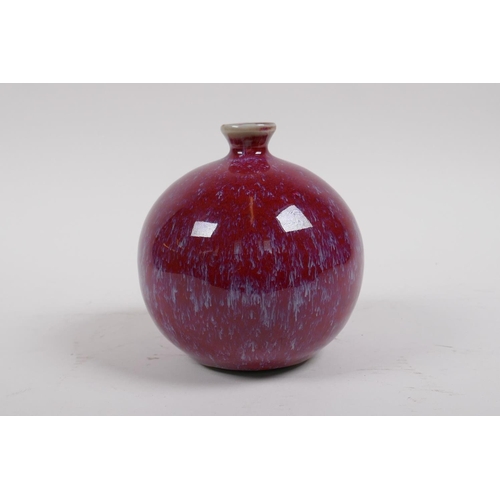 38 - A Chinese flambe glazed porcelain pomegranate shaped bud vase, 12cm high