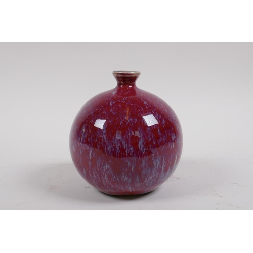 38 - A Chinese flambe glazed porcelain pomegranate shaped bud vase, 12cm high