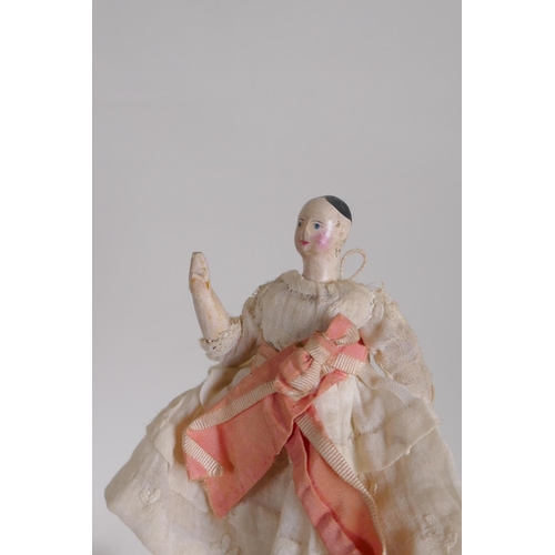 42 - A collection of C19th porcelain and composition dolls in tailored clothing, largest 23cm