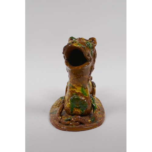 45 - A late C19th/early C20th Turkish canakkale pottery lion, with yellow, green and brown drip glaze, 22... 