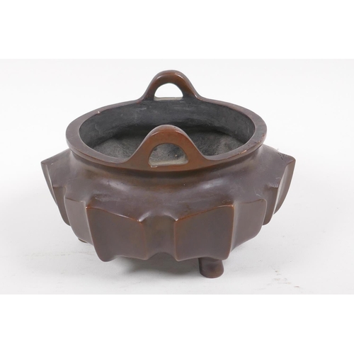 50 - A Chinese lotus flower shaped bronze censer with loop handles on tripod supports, impressed characte... 