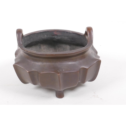 50 - A Chinese lotus flower shaped bronze censer with loop handles on tripod supports, impressed characte... 