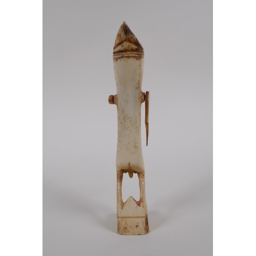 53 - An antique Indonesian carved bone ceremonial figure, 15cm high