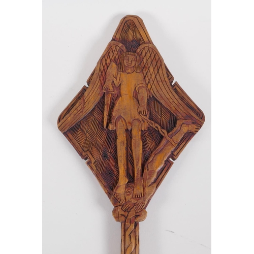 54 - An Ethiopian carved wood coptic cross with figural decoration, 42cm long