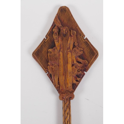 54 - An Ethiopian carved wood coptic cross with figural decoration, 42cm long