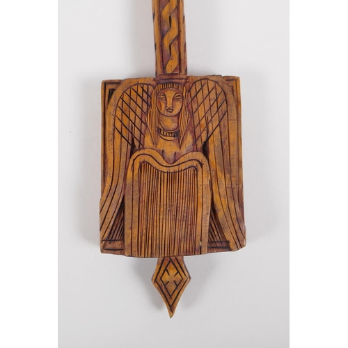 54 - An Ethiopian carved wood coptic cross with figural decoration, 42cm long