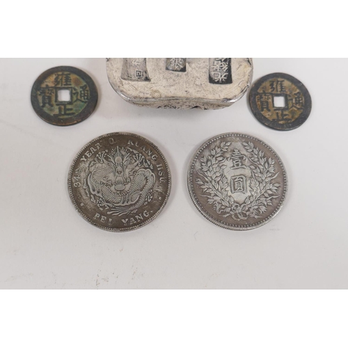 55 - A Chinese white metal trade token and five facsimile (replica) coins, token 6 x 4cms