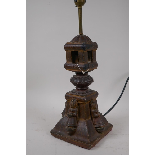 57 - An Indian carved wood table lamp in the form of a temple with applied figural decoration, 44cm high