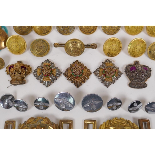 59 - A collection of assorted British Military buttons, belt buckles and patches etc