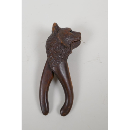 64 - An antique Black Forest bear head nut cracker, AF, 20cm