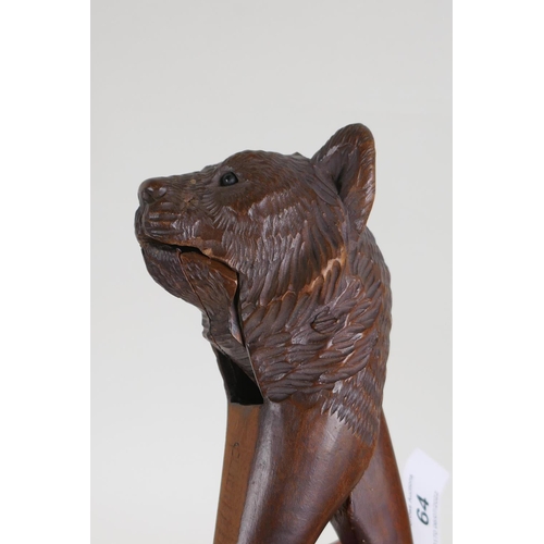 64 - An antique Black Forest bear head nut cracker, AF, 20cm