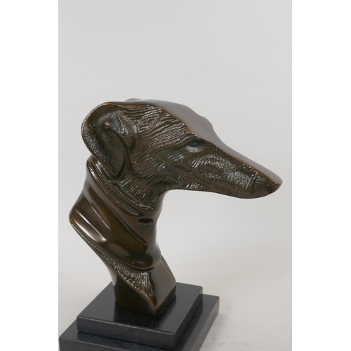 67 - A stylised head bust of a greyhound mounted on a stepped marble base, 23cm high