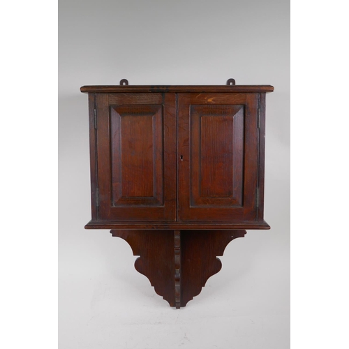 81 - A late C19th oak hanging smoker's cabinet constructed from timbers of H.M.S. Victory, brass plaque t... 