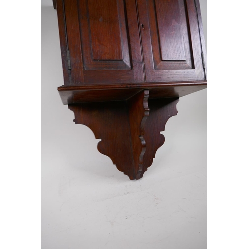 81 - A late C19th oak hanging smoker's cabinet constructed from timbers of H.M.S. Victory, brass plaque t... 