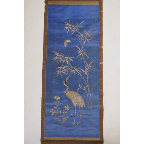 87 - A late C19th/early C20th Japanese silver thread on silk embroidered scroll depicting a red crowned c... 