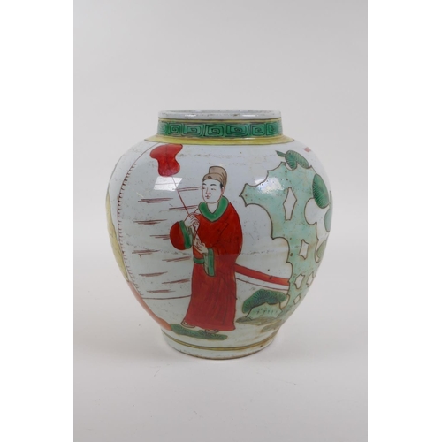 20 - A Chinese Wucai pottery jar decorated with figures in a landscape, 21cm high