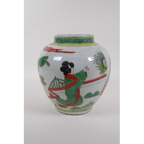 20 - A Chinese Wucai pottery jar decorated with figures in a landscape, 21cm high