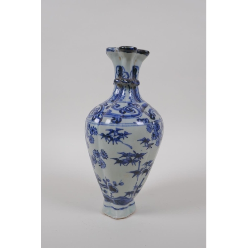 38 - A Chinese blue and white porcelain multi stem vase with two handles and cypress tree decoration, 21c... 