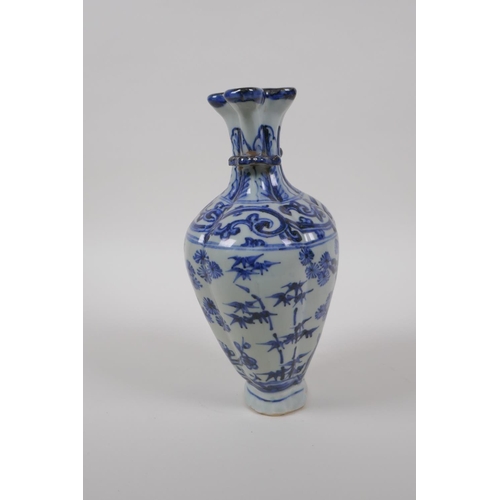 38 - A Chinese blue and white porcelain multi stem vase with two handles and cypress tree decoration, 21c... 