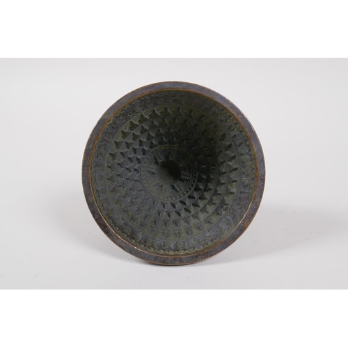 41 - A Tibetan cast bronze Tsa Tsa Stupa mold, 9cm diameter