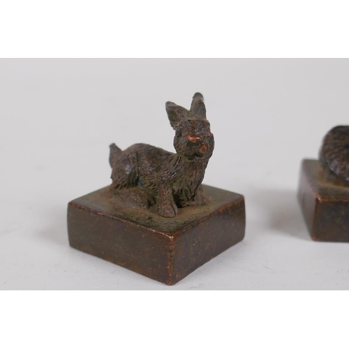 51 - Three Chinese cast bronze seals with zodiac animal mounts, and a bronze ganesh pendant, seals 2.5 x ... 