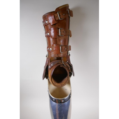 100 - An early C20th French leather and metal prosthetic leg by Leridon of Paris, 76cm 