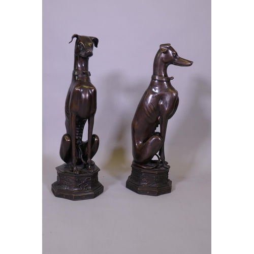 103 - A large pair of bronze greyhounds seated on octagonal plinths, in the manner of Alfred Barye, 74cm h... 