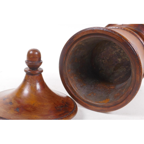 108 - A treen turned fruitwood tobacco jar/tea caddy with cover and painted heraldic shield, 25cm high