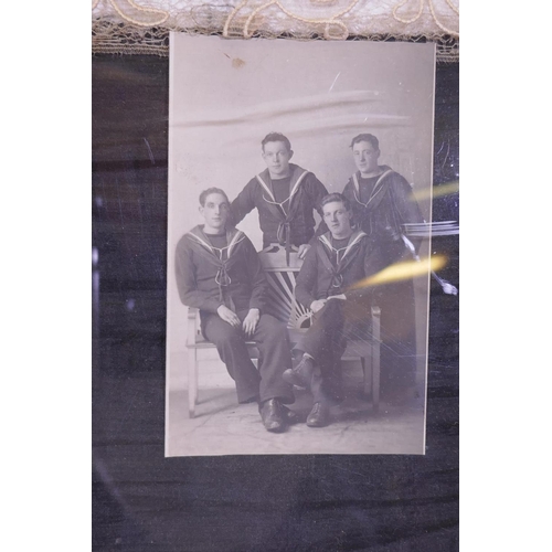 114 - An embroidered silk with lace border and photograph of crew mates of HMS Ironduke, early C20th