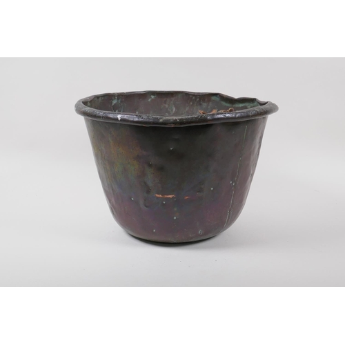 116 - An antique riveted copper bucket, 29cm diameter