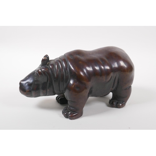 123 - A Chinese filled bronze hippo, 21cm long