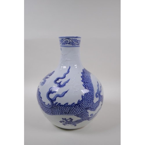 133 - A blue and white porcelain vase decorated with a dragon in flight, Chinese Xuande 6 character mark t... 