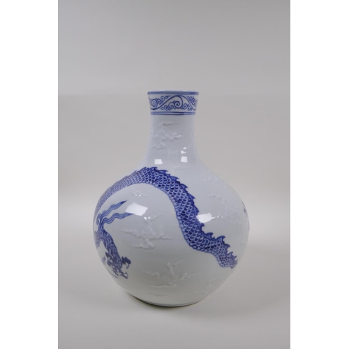 133 - A blue and white porcelain vase decorated with a dragon in flight, Chinese Xuande 6 character mark t... 