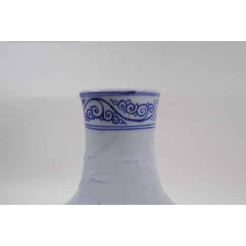 133 - A blue and white porcelain vase decorated with a dragon in flight, Chinese Xuande 6 character mark t... 