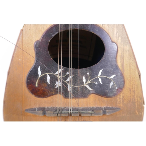 148 - An Italian mandolin by Gennaro Maylioni, Napoli, and a travel case, mandolin 60cm long