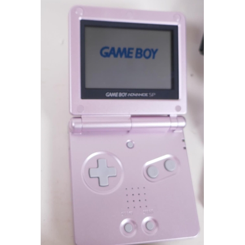 151 - A Gameboy Nintendo Advance SP console, a Nintendo DS console and five games, Crash Bandicoot Fusion,... 