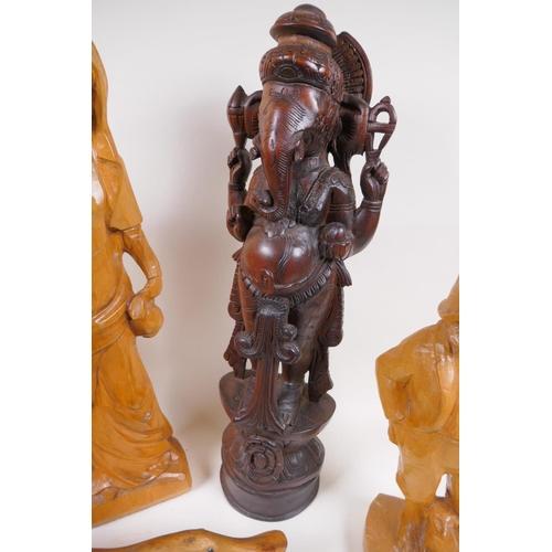 168 - A carved wood figure of a rhinoceros, 26cm long, AF, two carved wood ducks, male and female figures ... 