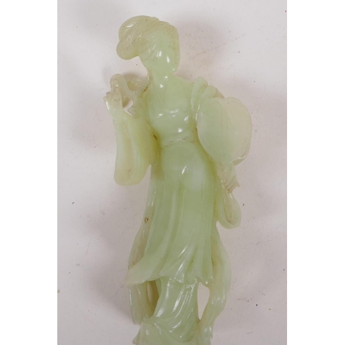 19 - A Chinese green hardstone figure of a girl with a lion, 15cm high