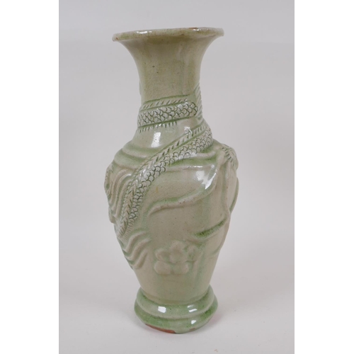 22 - An oriental celadon glazed porcelain vase, embossed with dragons (drilled), 30cm