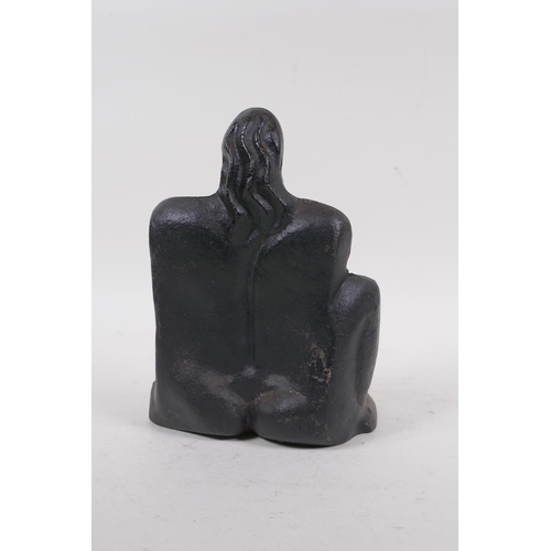 234 - A cast iron figure of a nude in the manner of Henry Moore, stamped M.N., 19cm high