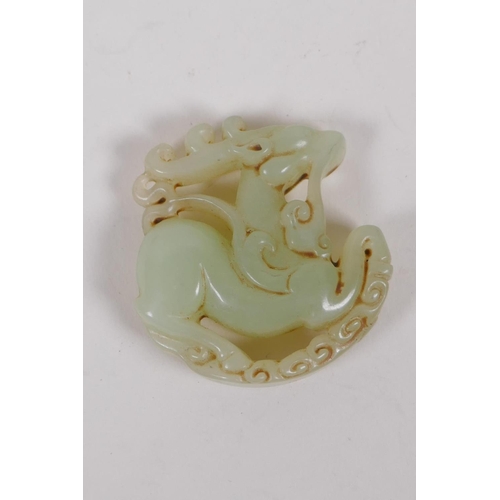 235 - A Chinese carved celadon jade deer pendant, 5cm diameter