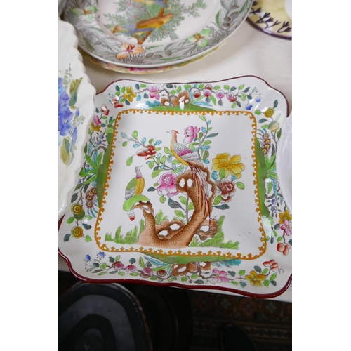 236 - A quantity of pottery and porcelain tazza chargers, serving plates etc, large tazza 18.5cm high